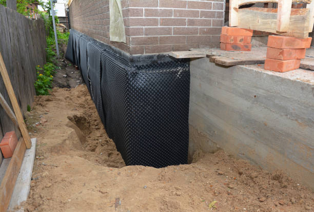 Happy homeowners after waterproofing job in Valley City